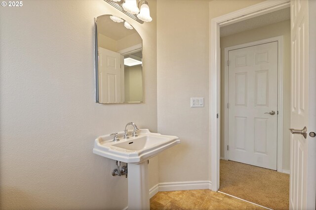 bathroom featuring baseboards