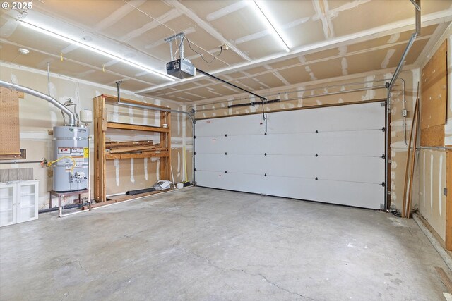 garage with strapped water heater and a garage door opener