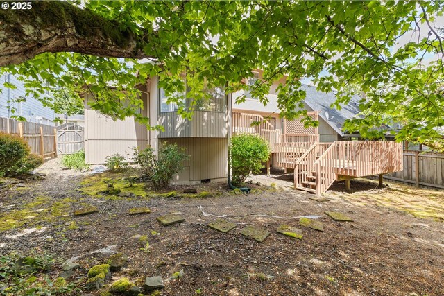 view of yard with fence and a wooden deck