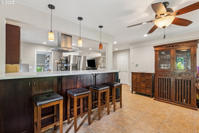 4315 NE 90th Ave, Portland, OR 97220 - kitchen with stainless steel refrigerator with ice dispenser, light tile patterned floors, a breakfast bar area, ceiling fan, and island range hood