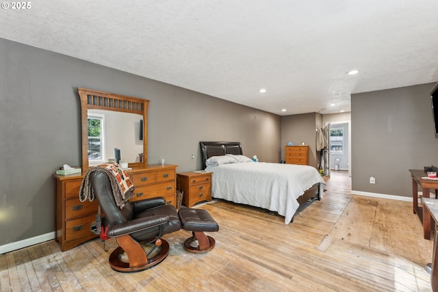 4315 NE 90th Ave, Portland, OR 97220 - bedroom with light wood-style flooring, baseboards, and recessed lighting