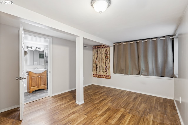 4315 NE 90th Ave, Portland, OR 97220 - basement with light wood finished floors, a sink, and baseboards