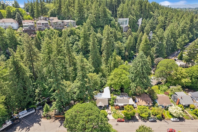 4315 NE 90th Ave, Portland, OR 97220 - aerial overview of property's location featuring a forest and nearby suburban area