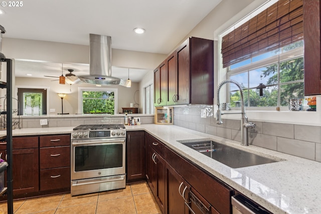 4315 NE 90th Ave, Portland, OR 97220 - kitchen with gas stove, a sink, island exhaust hood, light stone countertops, and recessed lighting