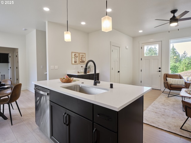 117 Witherbee Rd, Kelso, WA 98626 - kitchen with a sink, stainless steel dishwasher, dark cabinets, ceiling fan, and light countertops