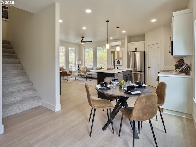 117 Witherbee Rd, Kelso, WA 98626 - dining area featuring recessed lighting, stairway, light wood-style flooring, a ceiling fan, and baseboards
