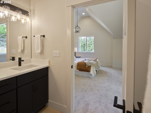 117 Witherbee Rd, Kelso, WA 98626 - bathroom featuring vanity, baseboards, lofted ceiling, and recessed lighting