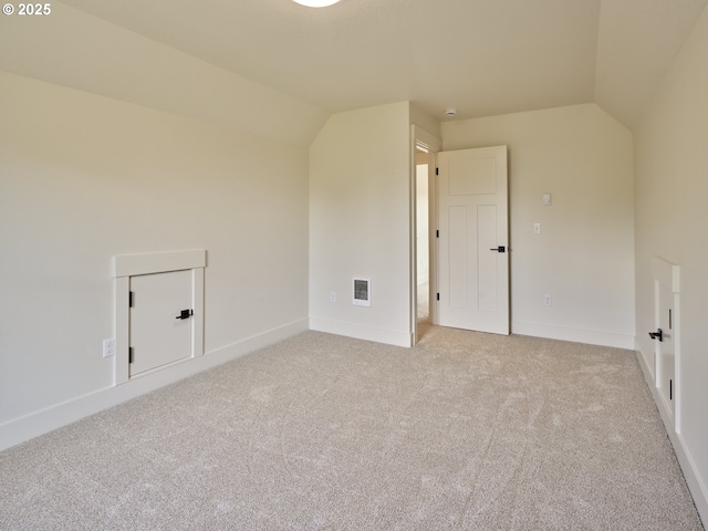 117 Witherbee Rd, Kelso, WA 98626 - empty room featuring vaulted ceiling, light carpet, and baseboards