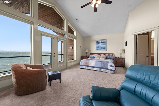 12 NW 17th Pl, Warrenton, OR 97146 - bedroom featuring carpet floors, access to exterior, french doors, a water view, and high vaulted ceiling