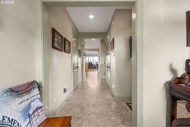 12 NW 17th Pl, Warrenton, OR 97146 - hallway featuring baseboards and stone finish flooring