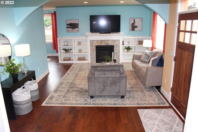 2917 SW 198th Ave, Beaverton, OR 97003 - living room with arched walkways, dark wood finished floors, a fireplace, and recessed lighting