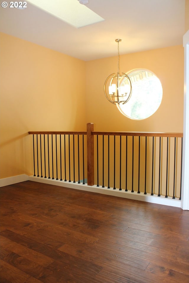 2917 SW 198th Ave, Beaverton, OR 97003 - spare room with a chandelier and dark wood-style flooring