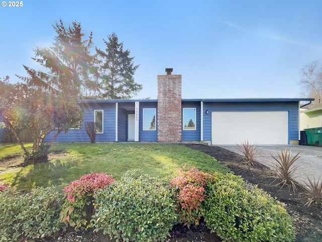 single story home with an attached garage, a chimney, concrete driveway, and a front lawn