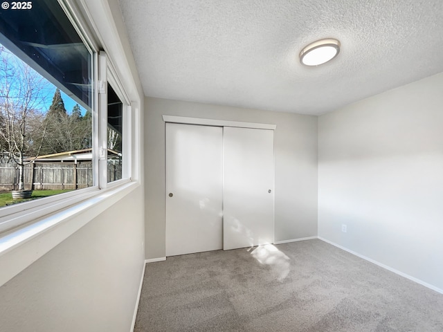 bathroom featuring visible vents, a textured ceiling, vanity, and baseboards