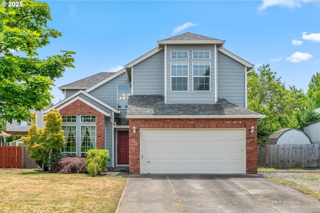 702 SW Burlingame Cir, Troutdale, OR 97060 - traditional home featuring brick siding, an attached garage, driveway, and roof with shingles