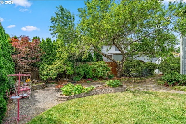 702 SW Burlingame Cir, Troutdale, OR 97060 - fenced backyard with a fire pit and a patio area