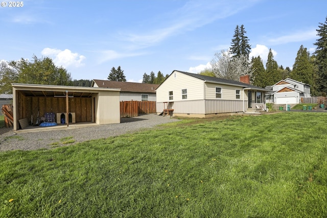 53112 NW Manor Dr, Scappoose, OR 97056 - rear view of property with an outbuilding, fence, a lawn, and a chimney