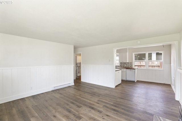 53112 NW Manor Dr, Scappoose, OR 97056 - unfurnished living room with wainscoting, baseboard heating, and dark wood-style floors