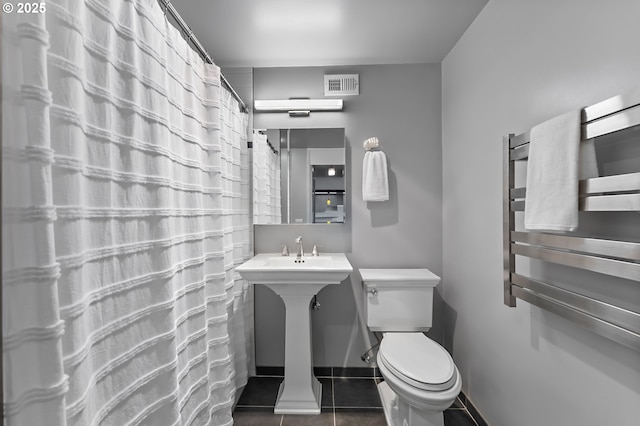 1220 NE 17th Ave Unit 12B, Portland, OR 97232 - bathroom featuring tile patterned flooring and a shower with shower curtain