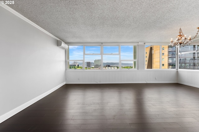 1220 NE 17th Ave Unit 12B, Portland, OR 97232 - unfurnished sunroom featuring a chandelier and an AC wall unit