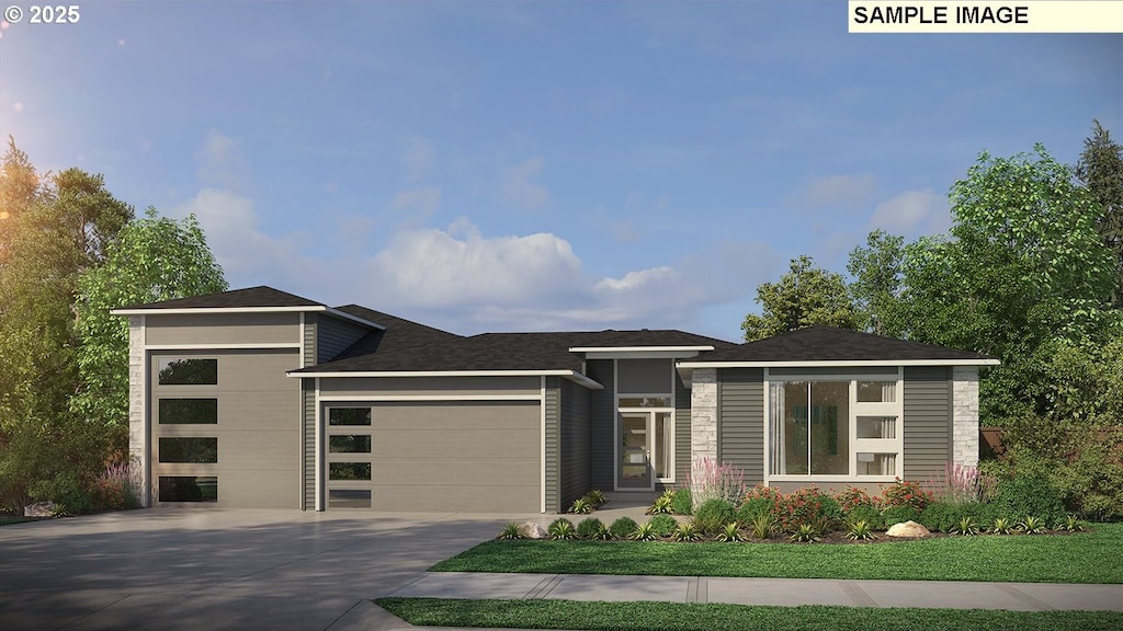 prairie-style house featuring an attached garage and driveway