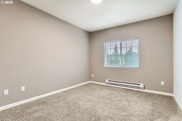 carpeted empty room with baseboards and baseboard heating
