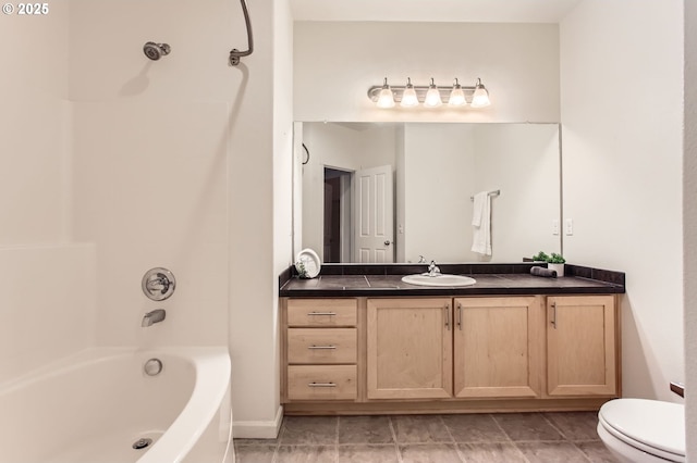 full bathroom featuring vanity, bathtub / shower combination, baseboards, and toilet