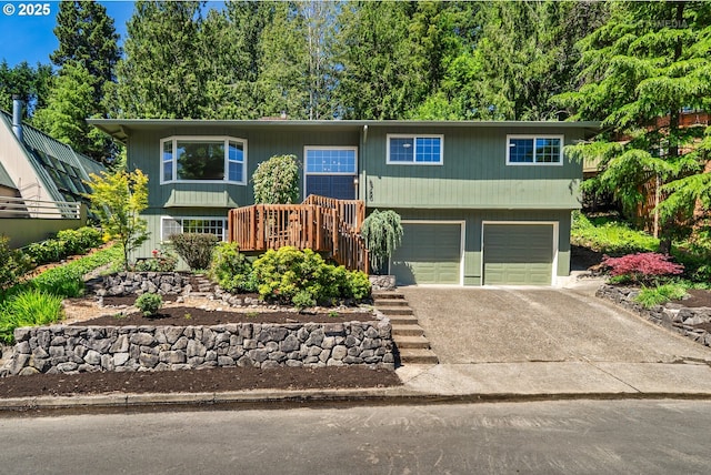 6750 SW Parkwest Ln, Portland, OR 97225 - split foyer home with an attached garage, driveway, and stairs