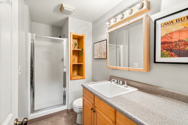 6750 SW Parkwest Ln, Portland, OR 97225 - bathroom with vanity, a shower stall, toilet, and tile patterned flooring