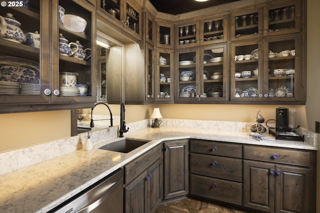 bar featuring a sink and dishwasher