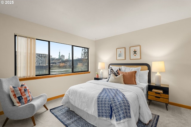 carpeted bedroom featuring a water view