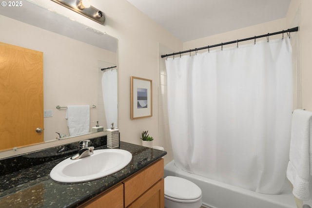 full bathroom featuring vanity, shower / tub combo, and toilet