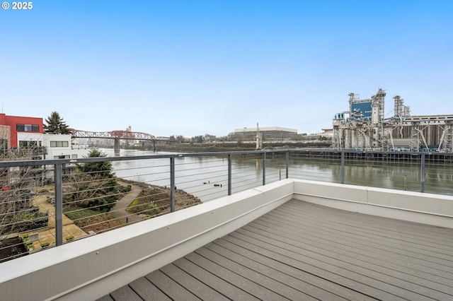 wooden terrace with a water view