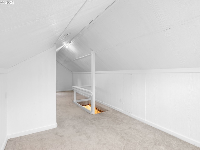 121 NE Edison St, Hillsboro, OR 97124 - additional living space with vaulted ceiling, carpet floors, and baseboards