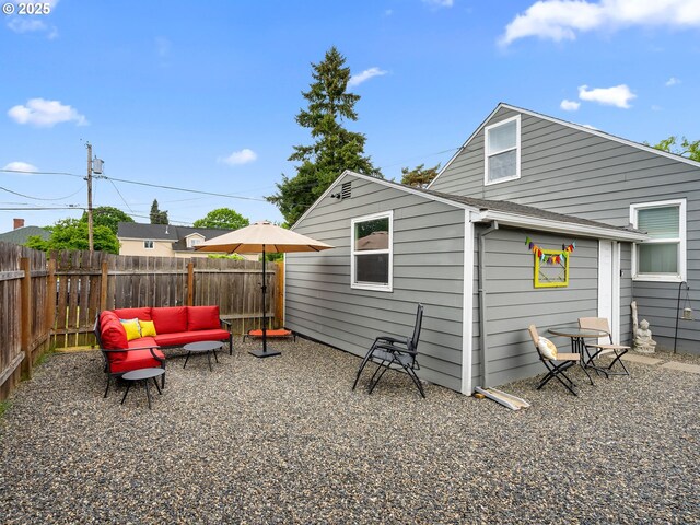 121 NE Edison St, Hillsboro, OR 97124 - rear view of house with fence and an outdoor hangout area