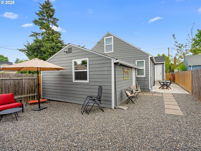 121 NE Edison St, Hillsboro, OR 97124 - rear view of property featuring a fenced backyard and a patio area