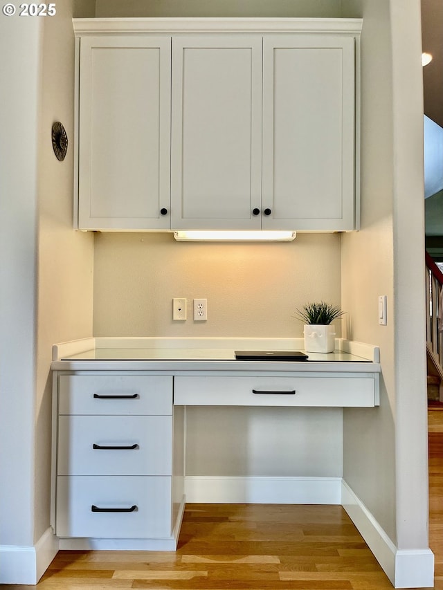detailed view of wood finished floors and baseboards
