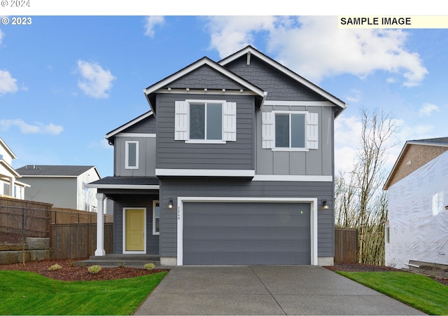 view of front of home with a garage, fence, board and batten siding, and driveway