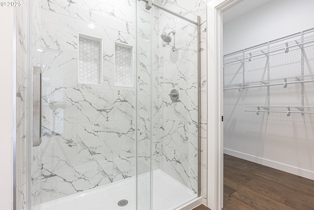 413 S Trade St, Amity, OR 97101 - full bath featuring a marble finish shower, wood finished floors, and a walk in closet