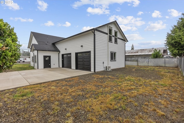 413 S Trade St, Amity, OR 97101 - view of home's exterior featuring a garage, driveway, and board and batten siding