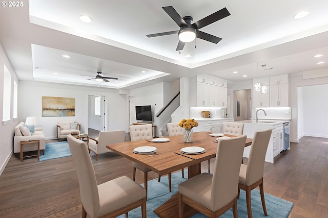 413 S Trade St, Amity, OR 97101 - dining area with a raised ceiling, a ceiling fan, stairs, dark wood-style floors, and baseboards