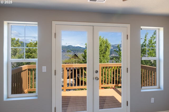 doorway to outside with a mountain view