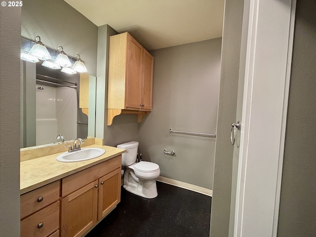 1134 SW Jefferson St Unit 503, Portland, OR 97201 - bathroom featuring toilet, vanity, a shower, and baseboards