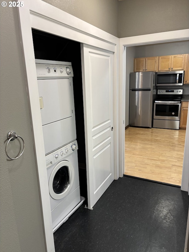 1134 SW Jefferson St Unit 503, Portland, OR 97201 - laundry area featuring estacked washer and dryer