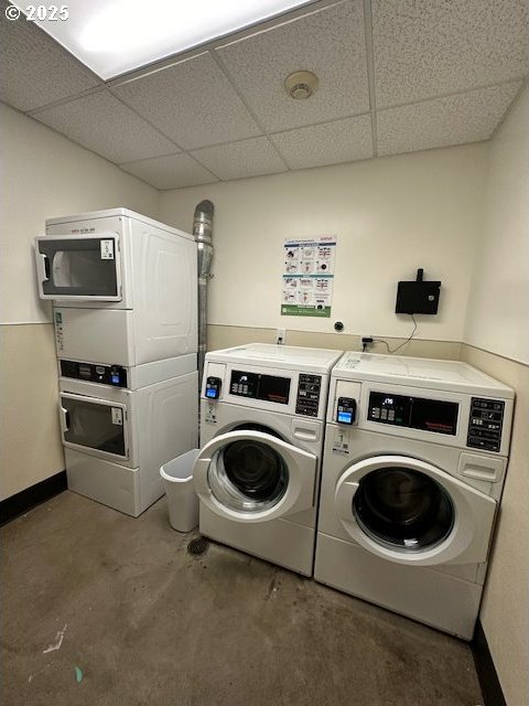 1134 SW Jefferson St Unit 503, Portland, OR 97201 - community laundry with estacked washer and dryer, washing machine and clothes dryer, and baseboards