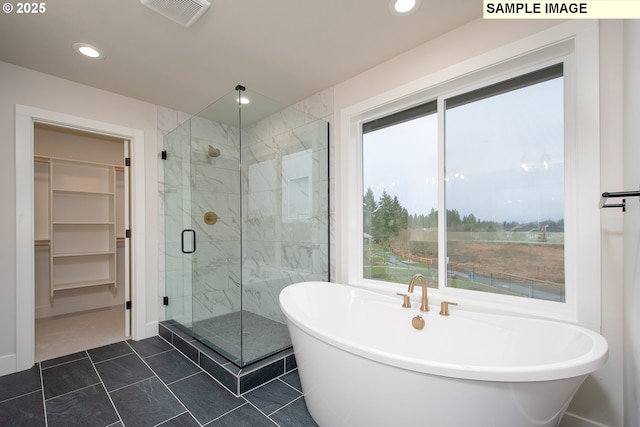 bathroom featuring tile patterned floors and plus walk in shower