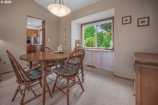 8911 SW 49th Ave, Portland, OR 97219 - dining room featuring light colored carpet and baseboards