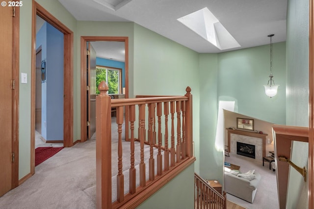 8911 SW 49th Ave, Portland, OR 97219 - corridor featuring an upstairs landing, carpet, and a skylight
