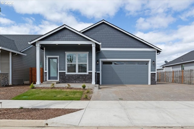 1026 Sassafras St, Independence, OR 97351 - view of front facade with stone siding, a garage, and driveway