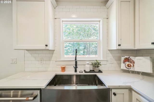 18891 Upper Midhill Dr, West Linn, OR 97068 - kitchen with a sink, stainless steel dishwasher, backsplash, and white cabinets